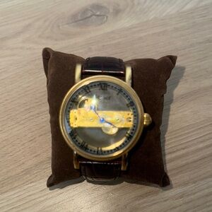 Gold Skeleton Dial Watch with Dark Strap